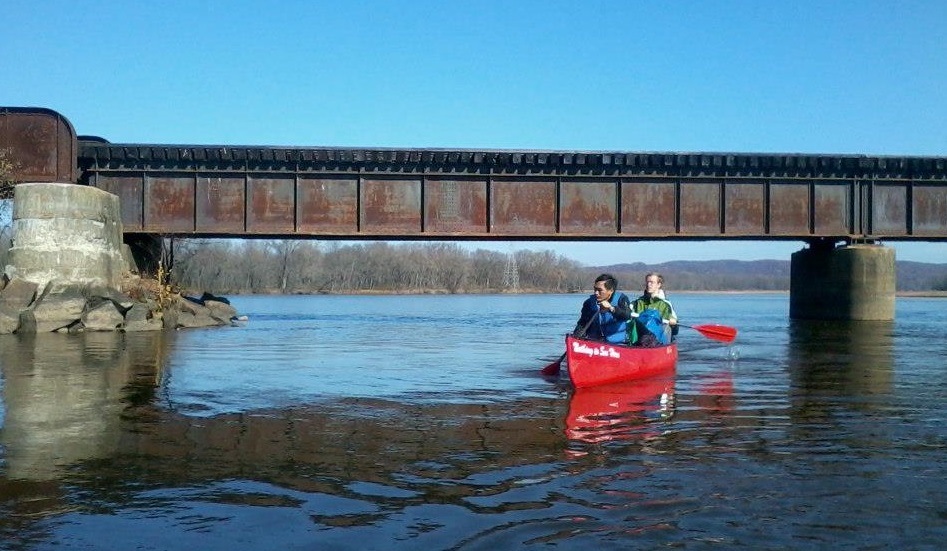 photo of people canoeing in a river