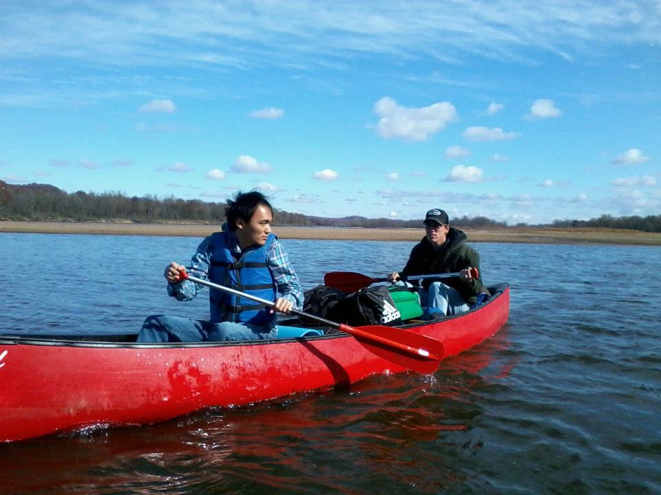 photo of two guys canoeing