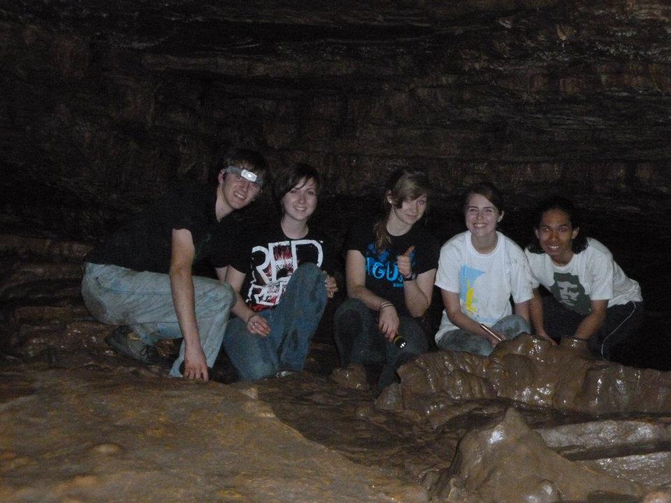 photo of group exploring a cave