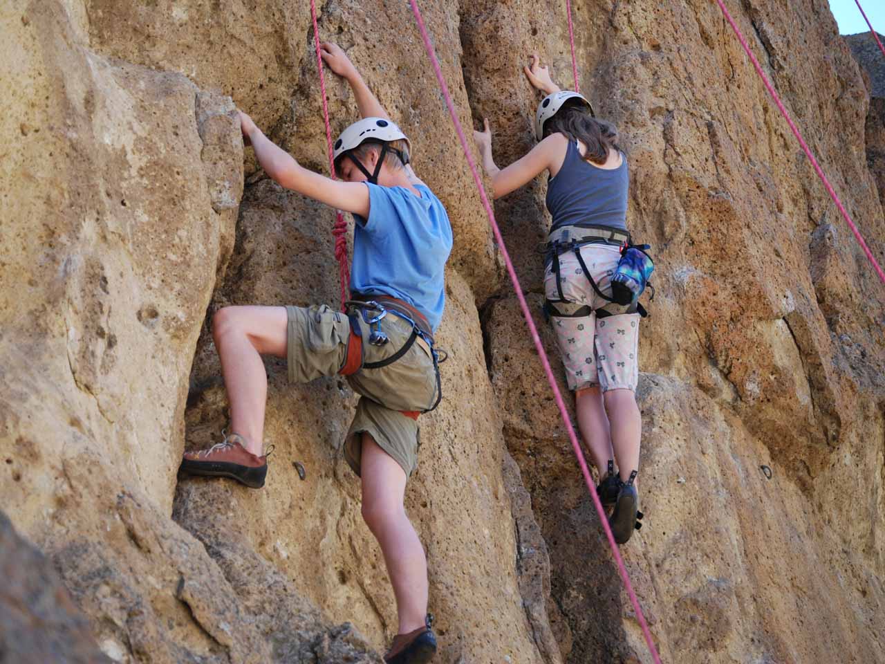 people of two people rockclimbing